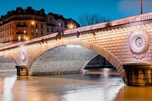 Twilight scene from Paris Seine River with fantastic colors during sunset. photo