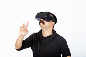 Man is pointing the space and shocking cyber realm during virtual reality experience. photo