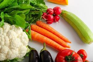 Isolated group of winter season vegetables over white flat lay view. Includes copy space. photo