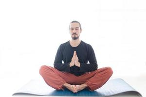 Man in peace with calm mood in meditation trance. Includes copy space, interior shot with professional performer. photo