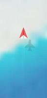 Top view of red origami paper airplane with realistic shadow on bokeh beach background. photo