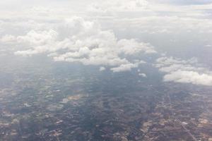 Blue sky with clouds on the airplane photo