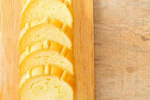 potatoes bread sliced on wood board photo