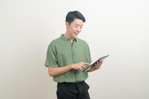 young Asian man using tablet photo