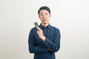 young Asian man holding credit card photo