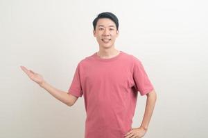 Asian man with hand pointing or presenting on white background photo