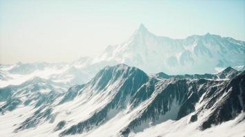 Mountain winter Caucasus landscape with white glaciers and rocky Peak photo