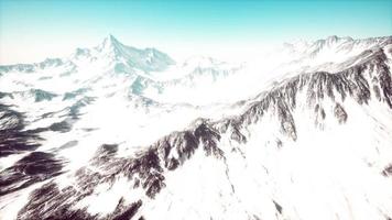 Mountain winter Caucasus landscape with white glaciers and rocky Peak photo