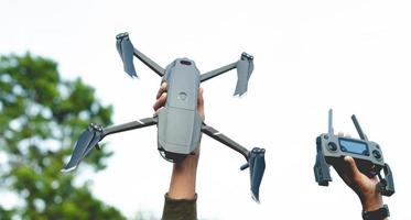 unmanned aerial photography equipment drone Hands and drones with camera taking 4k video photo