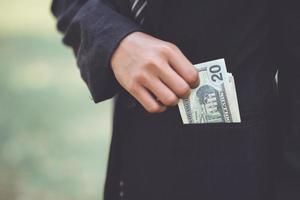 Hand and money of the little businessmen in school. photo