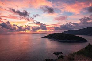 Scenery of tropical sea with colorful sky on Laem Promthep Cape, Phuket at the sunset photo