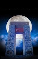 View of canakkale Martyrs' Monument with the moon at night. Background night sky with stars, moon and clouds. 18 March Canakkale Martyrs Monument. Modern and ready share and memorial design. photo