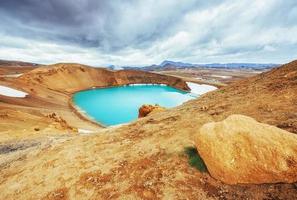 Giant volcano overlooks. Turquoise provides a warm geothermal wa photo