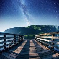 Fantastic starry sky and the Milky Way over the mountain photo