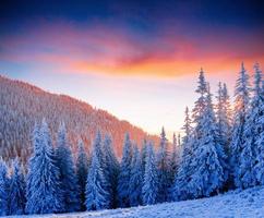 Colorful sunset over the mountain ranges in the national park photo