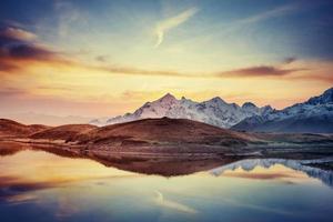 Sunset on mountain lake Koruldi. Upper Svaneti, Georgia, Europe. photo