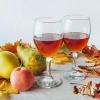 Autumn still life. Golden leaves a apples and pears photo