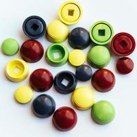 Colored plastic caps isolated on white background photo