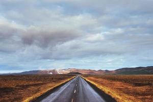 Road in mountains. Bridge over a channel connecting Jokulsarlon photo