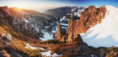 magical winter snow. Spring landscape. Sunset in the Carpathians photo