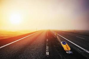 Road in mountains. Thick fog at sunset. Iceland photo