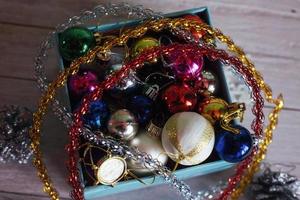 Paper box filled with colorful Christmas decorations, isolated o photo