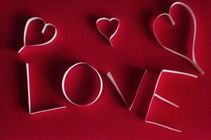 Valentine's day abstract background with cut paper heart photo