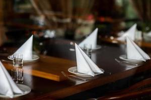 beautifully served table in a restaurant. selective focus. noise is present photo