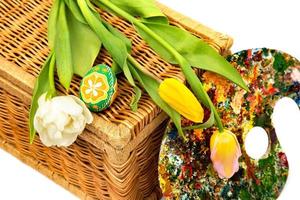 Easter eggs and tulips. Easter eggs with tulips on a white background, easter holiday concept. photo