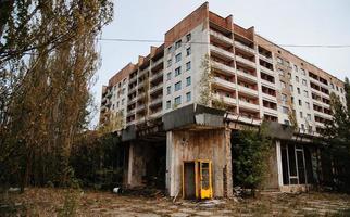 Chernobyl exclusion zone with ruins of abandoned pripyat city zone of radioactivity ghost town. photo