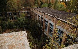 Chernobyl exclusion zone with ruins of abandoned pripyat city zone of radioactivity ghost town. photo