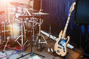 Set of musical instruments. Bass guitar and drums photo