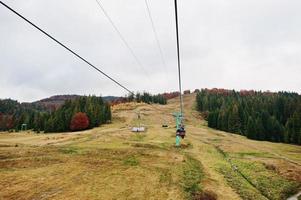 Cableway and ski lifts at autumn mountains