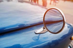 Side mirror of blue retro vintage car photo