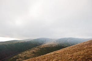 Great hills with snow covered at frozen morning on Carpathian mountains photo