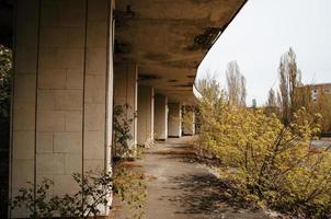 Chernobyl exclusion zone with ruins of abandoned pripyat city zone of radioactivity ghost town. photo