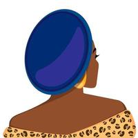Portrait of a beautiful African woman in a leopard print dress and turban. The concept of beauty, fashion, body positivity, style, equality.