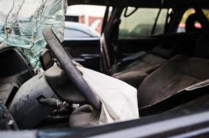 Car after accident. Steering wheel with airbag after crash photo