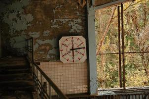 Lost school sport gym at Chernobyl city zone of radioactivity ghost town. photo