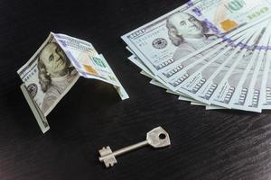 Mortgage, investment, real estate and property concept. Dollar money  house keys photo