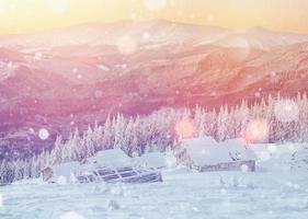 cabin in the mountains in winter, background with some soft high photo