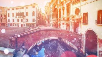 Canal in Venice, Italy. Photo greeting card. Bokeh light effect,