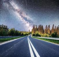 Fantastic starry sky and majestic mountains in the mist. Dramatic  beautiful morning. Autumn landscape. Courtesy of NASA photo