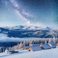 chalets in the mountains at night under the stars. Courtesy of NASA. Magic event in frosty day. In anticipation  the holiday