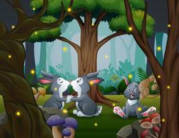 Funny three of bunnies in the park vector