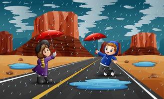 Happy children holding umbrella in raining vector
