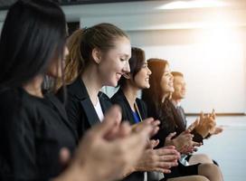 Business people executives applauding in  business meeting photo