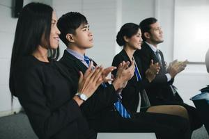 Business people executives applauding in  business meeting photo