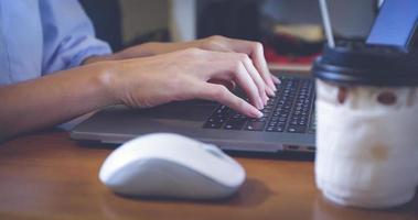 Asian woman is using a notebook computer for work at home and she is quarantine during the coronavirus epidemic. photo