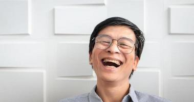 The senior Asian man smiled and laughed happy photo